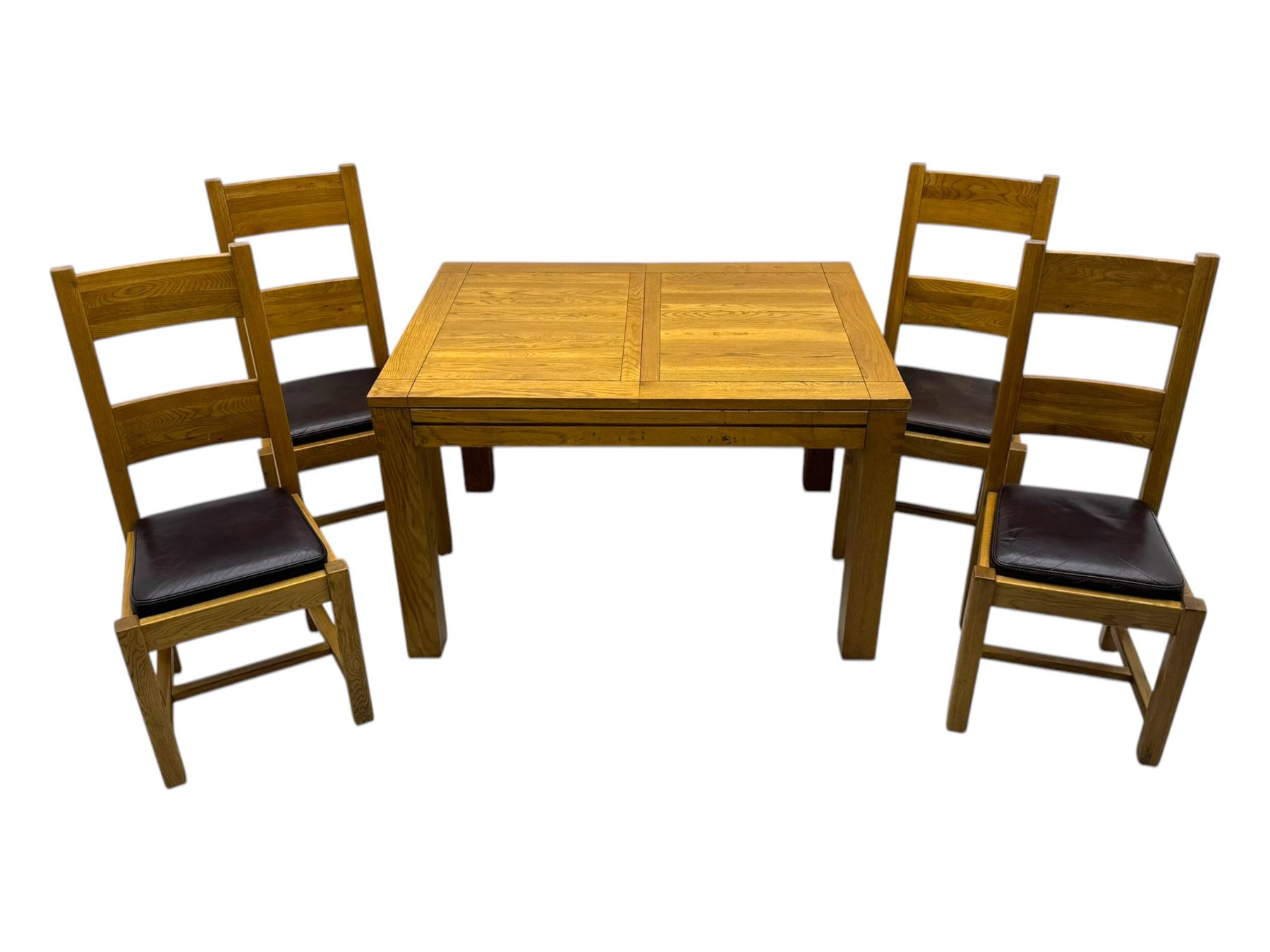 Contemporary oak dining table, rectangular panelled top with integral extension leaf, raised on square supports; set of four oak ladder-back chairs with padded brown seats