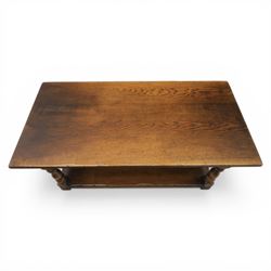 Oak coffee rectangular table, in the manner of Titchmarsh & Goodwin, raised on turned supports united by a full length undertier