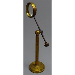  Late 19th/early 20th century gilt brass magnifying glass with convex lens on telescopic adjustable stand, H25cm max  
