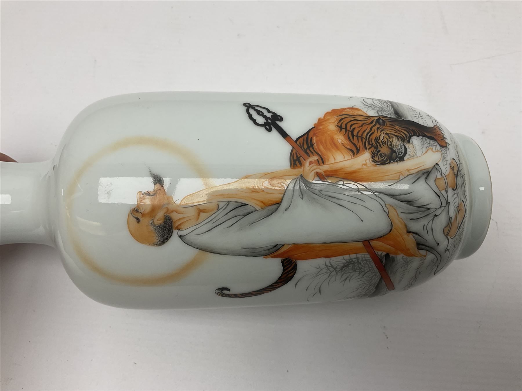 Chinese vase of baluster form decorated with immortal with a tiger, and script to back, H23cm