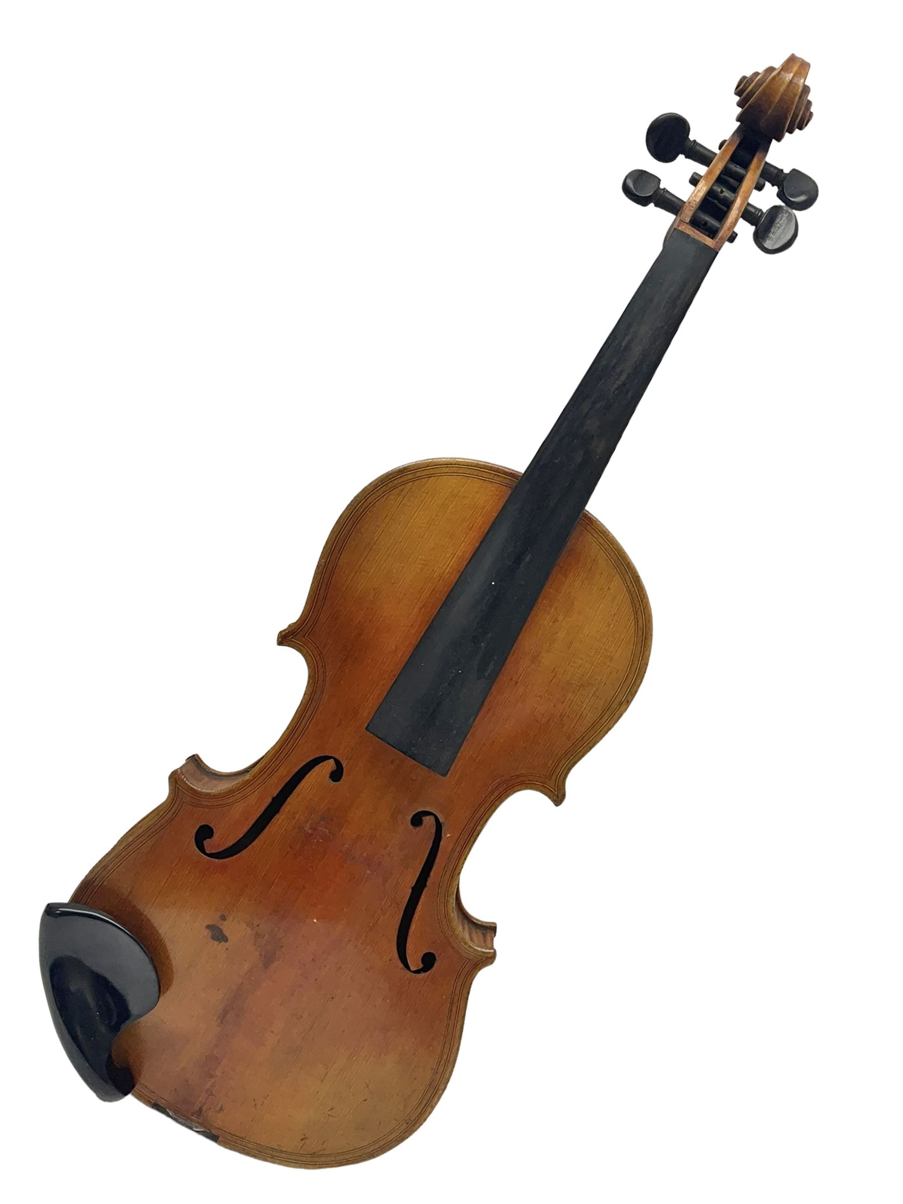 German trade violin c1900 copy of a Maggini with 36.5cm two-piece maple back and ribs and spruce top; double scroll; L60cm overall; in carrying case