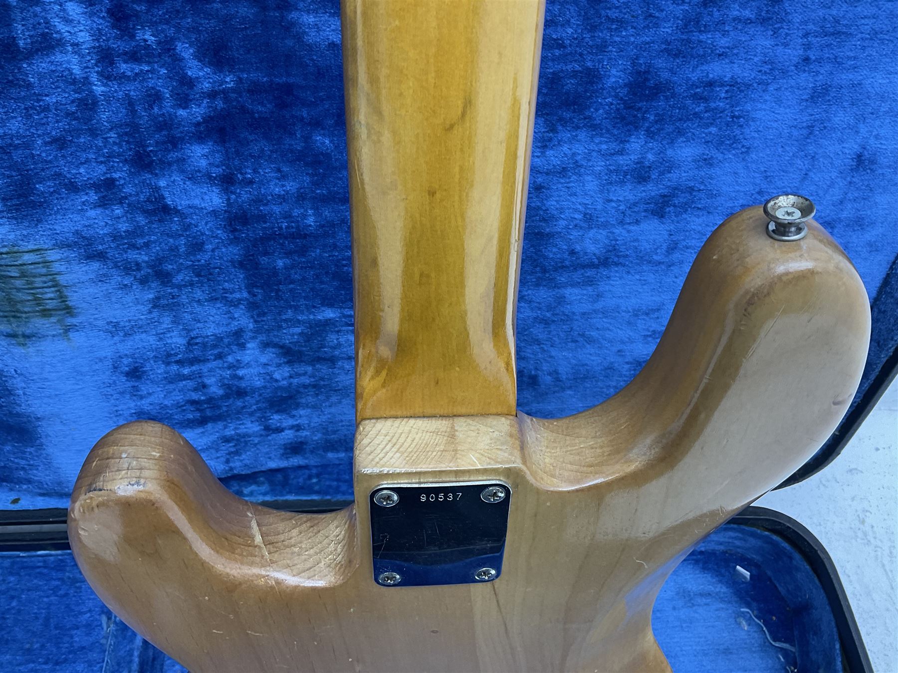 1962 Fender Precision bass guitar; re-finished in natural alder in the 1970s; impressed date code 5NOV62C to end of neck and serial no.90537 to back plate; L115.5cm; in replacement hard carrying case