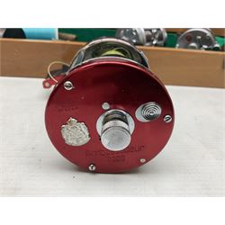 Four Abu fishing reels, comprising Ambassadeur 9000, Ambassadeur 7000, Ambassadeur 5500 and Ambassadeur 6500, together with additional line, hardy fishing bag and two wooden boxes