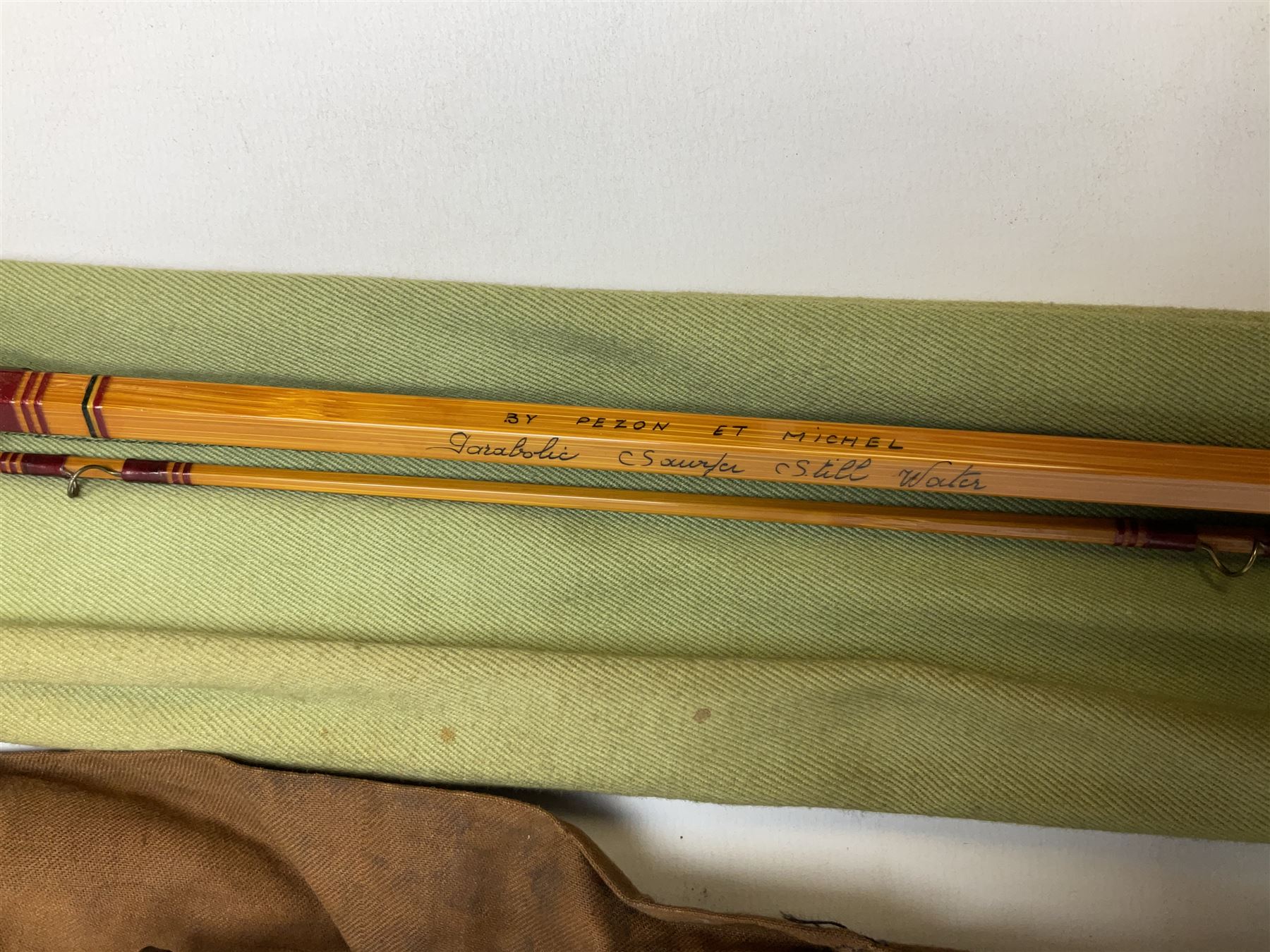 Four vintage split cane fishing rods in cloth bags, to include the Scottie Impregnated JS Sharpe rod and Pezon et Michel Farlow rod (4)