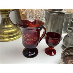 19th century cut ruby glass engraved A Present from Scarborough, with single handle, two decanters, two silver plated wine bottle coasters, collection of pewter tankards, brass oil lamp, copper mushroom repousse plaque and barometer