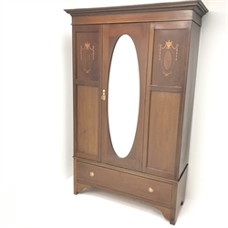  Edwardian inlaid mahogany wardrobe, single central oval mirrored door above two drawers, W131cm, H204cm, D52cm  