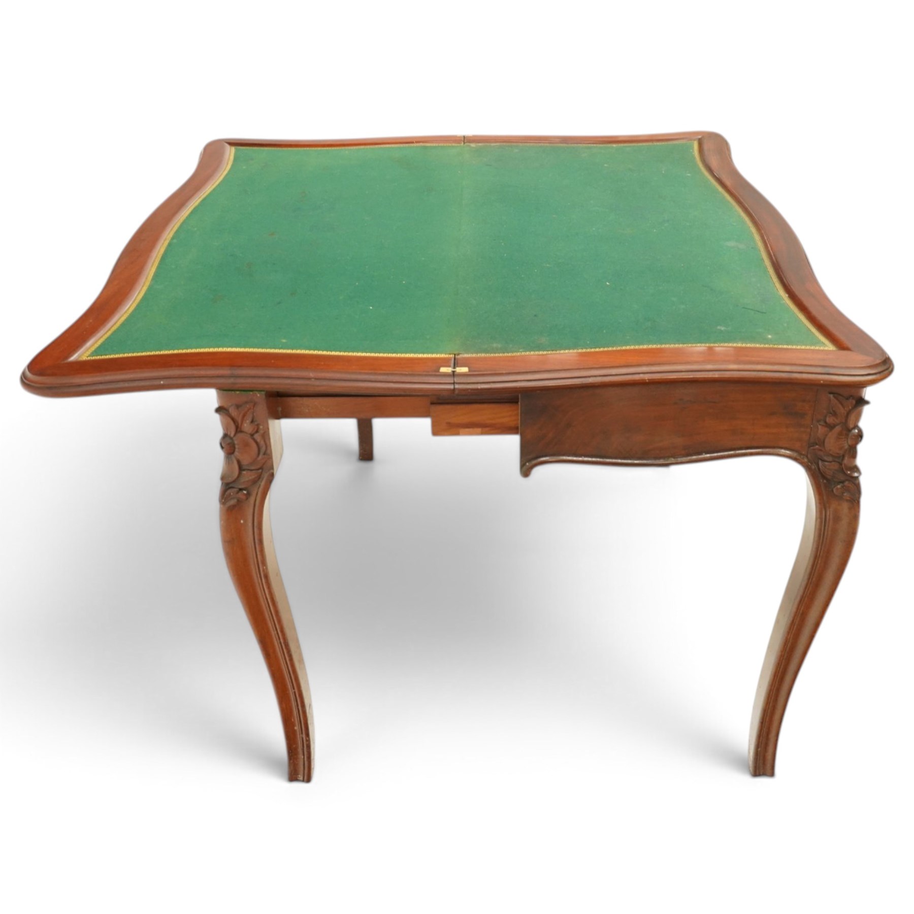 Victorian carved mahogany card table, shaped rectangular top with hinged fold-over top enclosing baize lined interior, supported on rear draw-supports, the frieze carved with anthemion and acanthus leaves, on cabriole legs