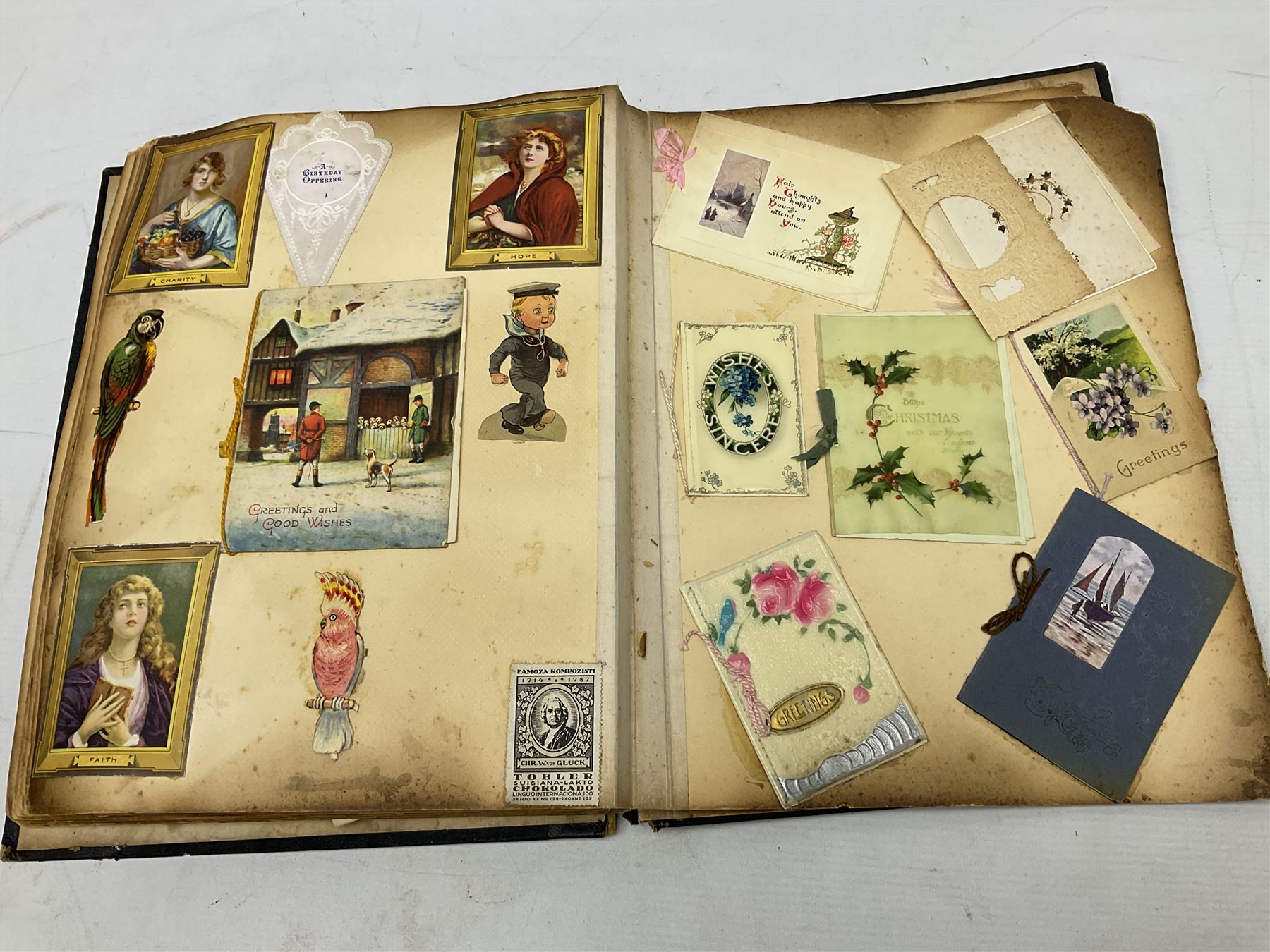Victorian scrapbook of various fixed decoupage to include, greeting cards, portraiture, flowers, animals etc,