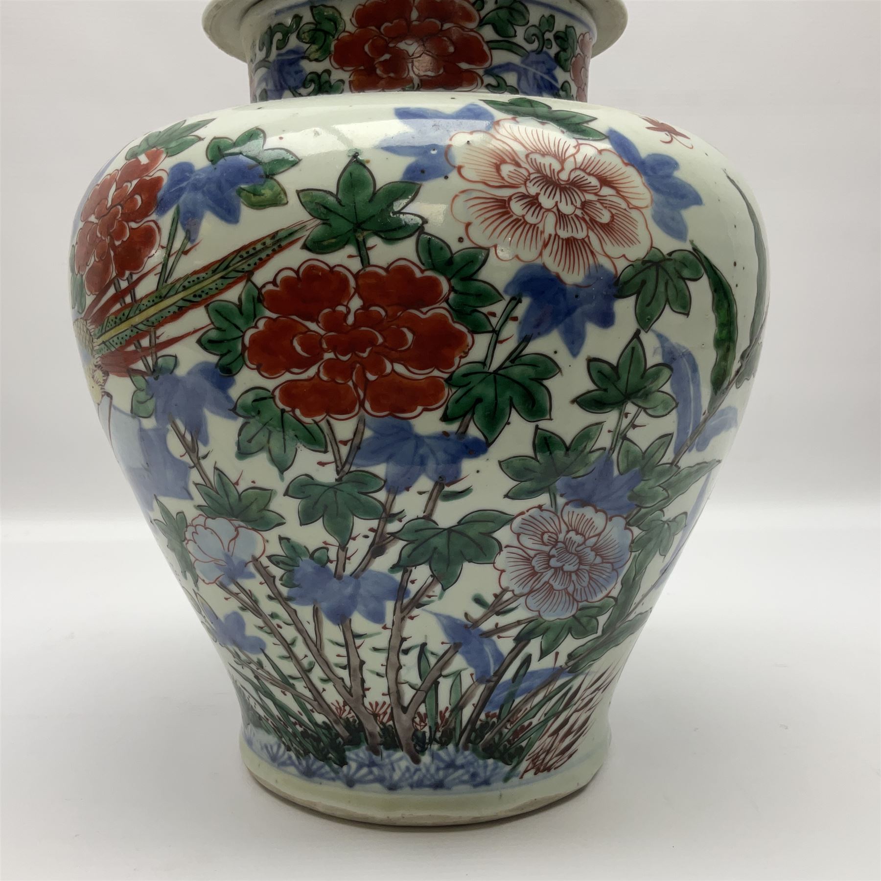 19th century Chinese Wucai vase and cover, decorated  with peacock on blue rockwork and other birds flying amongst tree peonies, H43cm