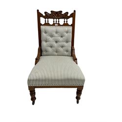 Late Victorian nursing chair upholstered in striped fabric