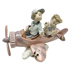 Lladro figure, Don't Look Down, modelled as a girl and boy in a plane, sculpted by Joan Coderch, no 5698, year issued 1990, year retired 2004, H17cm