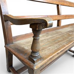 Early 20th century pine and oak bench seat, stained pine rail back frame with shaped oak arms