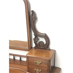  Victorian mahogany Duchess dressing table, arched bevelled swing mirror above four small drawers, shaped moulded top above single drawers, turned and carved supports on undertier, with Victorian revolving stool, W106cm, H147cm, D45cm  