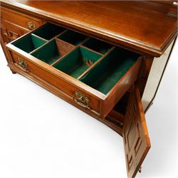 Early 20th century golden oak dresser sideboard, superstructure with three stained and leaded glass doors flanked by carved uprights above an open display shelf, the base with three drawers and geometric panelled cupboard doors, enclosing drawers with cutlery and bottle compartments, raised on short feet