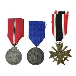  WWII German 'SS' Long Service Medal for four years; Ostfront Medal for the Winter Campaign in Russia of 1941-1942 'Die Medaille Winterschlacht Im Osten'; and War Merit Cross 2nd Class with swords; all with ribbons (3)