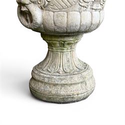 Pair of classic design cast stone garden urns, circular bowl detailed with lion mask loop handles