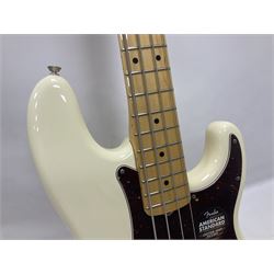 Fender Precision Bass guitar, in Olympic White finish with tortoiseshell effect scratchboard, serial no US15103092, in black Fender hard case with Fender strap and warranty card, guitar L116cm