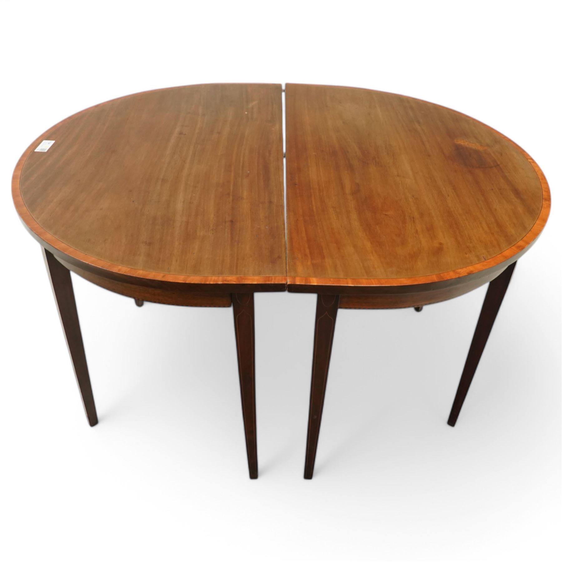 George III and later mahogany extending dining table, two D-ends, central drop-leaf table and loose leaf, satinwood banded tops, on square tapering supports with boxwood stringing