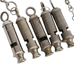 Collection of WWII ARP warden's whistles and similar together with RAF badge and similar 