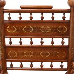 Pair of Anglo-Indian brass inlaid hardwood low chairs, the backs with turned spindle rails and rectangular panels inlaid with scrolling foliate decoration, woven rush seats within moulded frames, raised on turned supports with ring turned feet