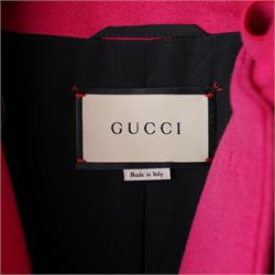 Gucci - wool ruffle-front single-breasted coat in bright fuchsia pink, with high ruffled collar, cascading ruffle trim to the front, collar and cuffs, faux pearl and gilt GG monogram logo button fastening, size 44, unused with the original garment bag and hanger