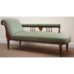  Edwardian walnut framed chaise longue, scrolled arm, turned supports, upholstered in a light green fabric, L160cm  