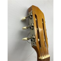 Encore black electric cut-away guitar L96cm; and Spanish Victor Garcia model 187 acoustic guitar, bears label dated 1972 L99cm; each in soft carrying case (2)