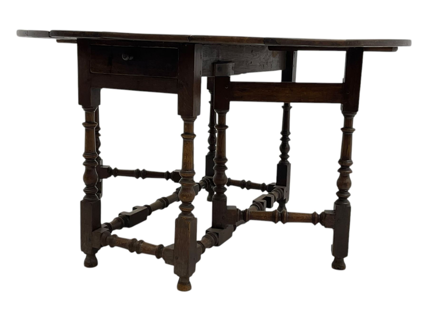 18th century oak drop leaf table, oval top with two drop leaves and frieze drawer, raised on turned supports with turned stretchers