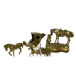 Three brass figures, one depicting a cowboy and his horse, two of horses and carts, largest H30cm