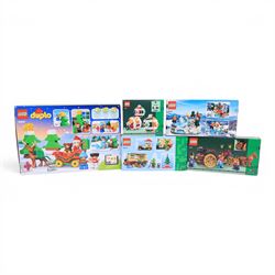 Five Lego sets, comprising Duplo Santa's Winter Holiday no. 10837, Christmas Decor Set no. 40604, Wintertime Carriage Ride no. 40603, Santa's Delivery Truck no. 40746 and Ice Skating Rink no. 40416, all boxed