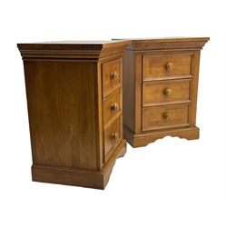 Pair of contemporary cherry wood bedside chests, rectangular top and projecting moulded cornice over three drawers, on plinth base with shaped apron