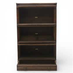 Globe Wernicke - early 20th century three sectional stacking library bookcase, two glazed sections above a panelled section, on a plinth base with inbuilt drawer