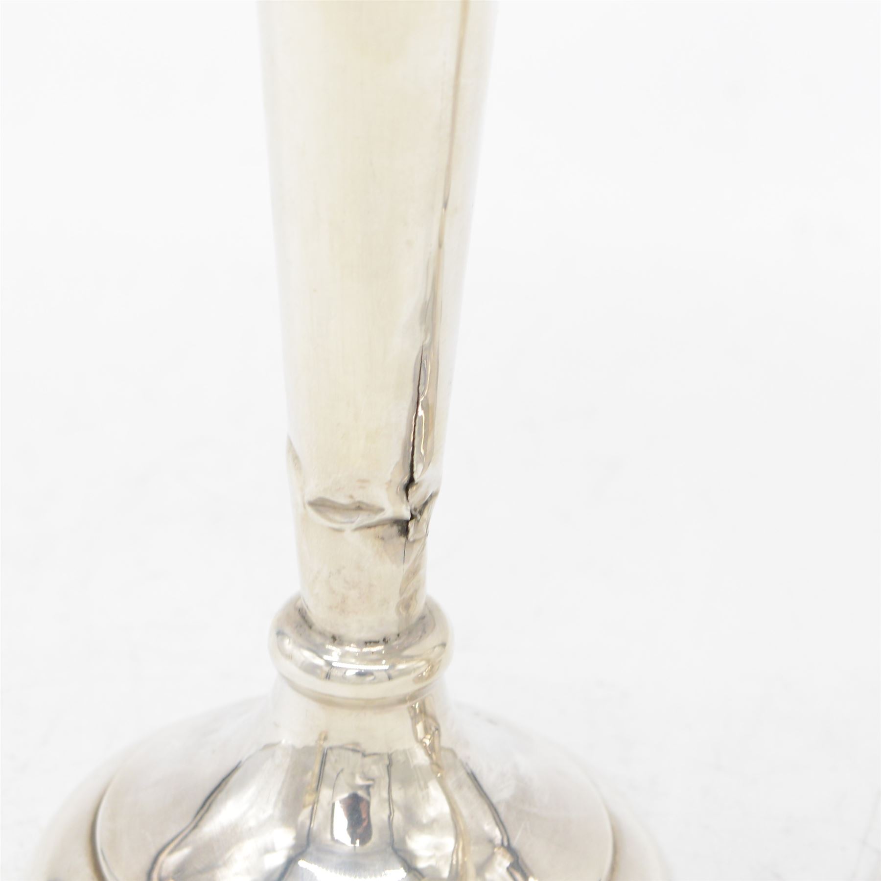 Two pairs of early 20th century silver vases, comprising pair of Edwardian trumpet vases with fluted rims upon a circular domed foot, hallmarked S Blanckensee & Son Ltd, Chester 1907, and a smaller 1920s pair, hallmarked Chester 1920, maker's mark worn and indistinct, tallest H19cm