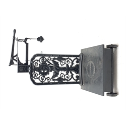19th century platform scales by Parnall & Sons. Bristol, black painted cast iron, raised back decorated with foliage scrolls and fruit garland, H128cm