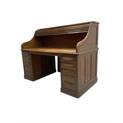 Cutler - early 20th century American oak tambour roll-top desk, the twin pedestals fitted with four graduating drawers