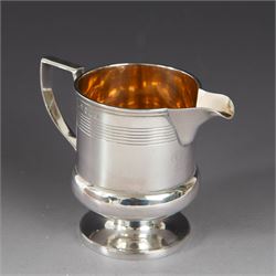 George III silver cream jug, of bellied form with ribbed decoration and angular handle, ha...