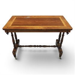 Victorian rosewood and beech stretcher table, rectangular walnut banded top, four turned legs and stretcher, raised on brass castors