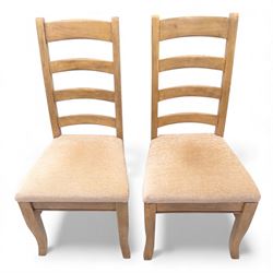 Barker and Stonehouse Flag Stone extending dining table and four matching chairs, the rectangular top with parquetry inlay and contrasting border, extending by central leaf, on slightly curved supports, the chairs with padded upholstered seats and ladder backs (Chairs H 108cm, W 50cm, D 54cm) (Extends to 195cm)