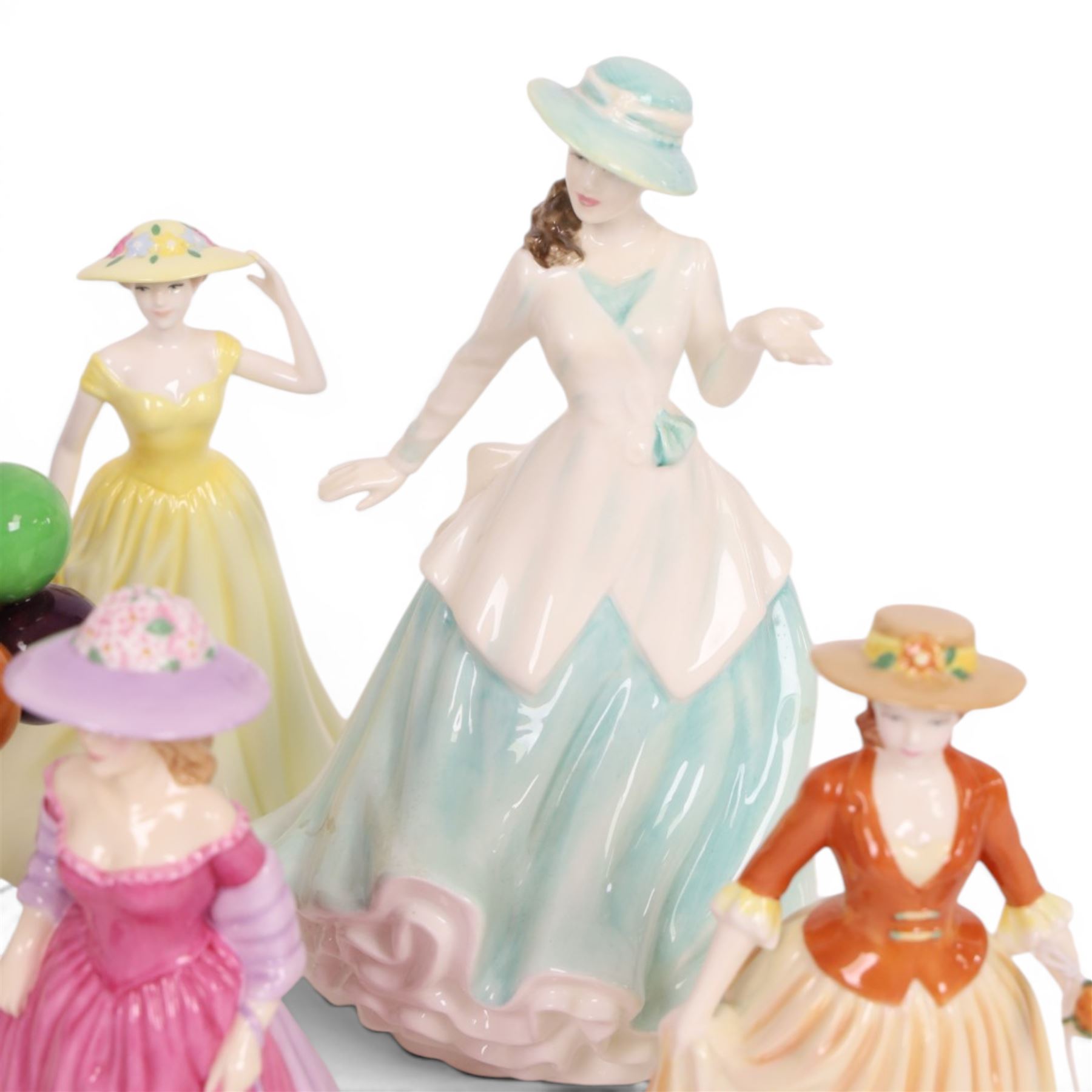 Collection of Royal Doulton figures including Autumn Stroll, April, Cinderella, The old Balloon Seller, Reflections etc 