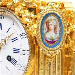 Charpentier & Cie-French 8-day mantle clock c 1860, in an ormolu case with Sevres style plaques, fluted pedestal case decorated with acanthus leaves and floral swags, surmounted by a putto and raised on toupie feet, convex enamel dial with Roman numerals, minute track and five-minute Arabic's, with makers name and Louis XVI style gilt hands, Parisian twin train movement with rack striking, sounding the hours and half-hours on a bell. With pendulum and key.
Charpentier & Cie, operated in Paris from around 1830 to 1860. They are especially well-known for their clock and garniture sets, as well as for their works of bronze. With pendulum and key.

