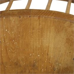 Ercol - Windsor dining chairs, set of four, each with rounded hoop back and four stick spindles, shaped elm seats with exposed plugs, raised on splayed beech tapering legs