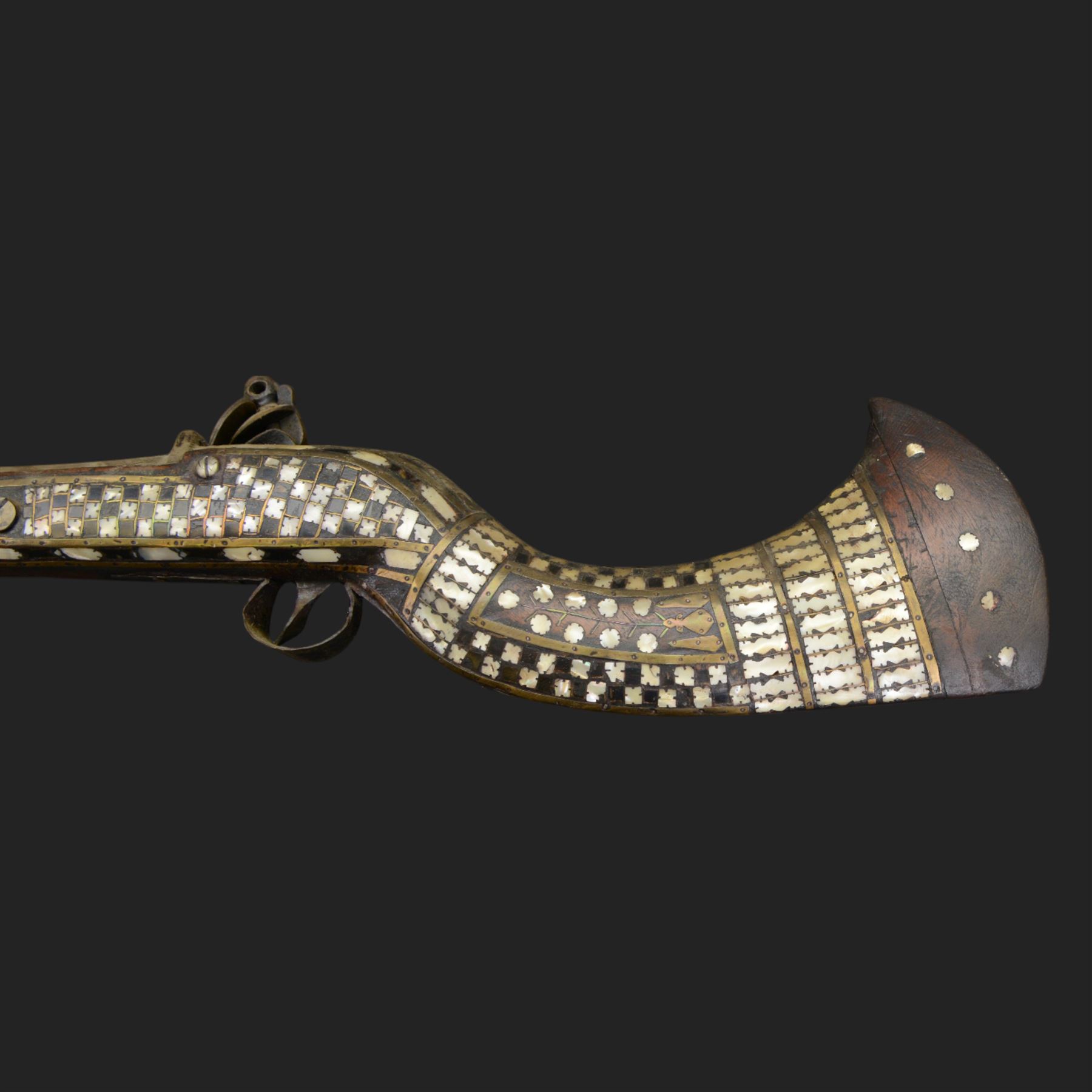 Indian Jezail style flintlock musket, with 118cm barrel, the East India Company lock marked 1818,  the curved butt inlaid with mother of pearl and brass decoration, overall L155cm
