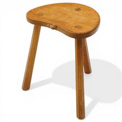 Mouseman - oak three-legged stool, dished kidney-shaped seat, raised on three octagonal sp...