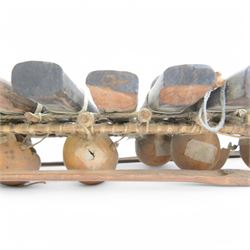 West African gourd-resonated balafon, with twenty hardwood tone bars and four beaters, L112cm