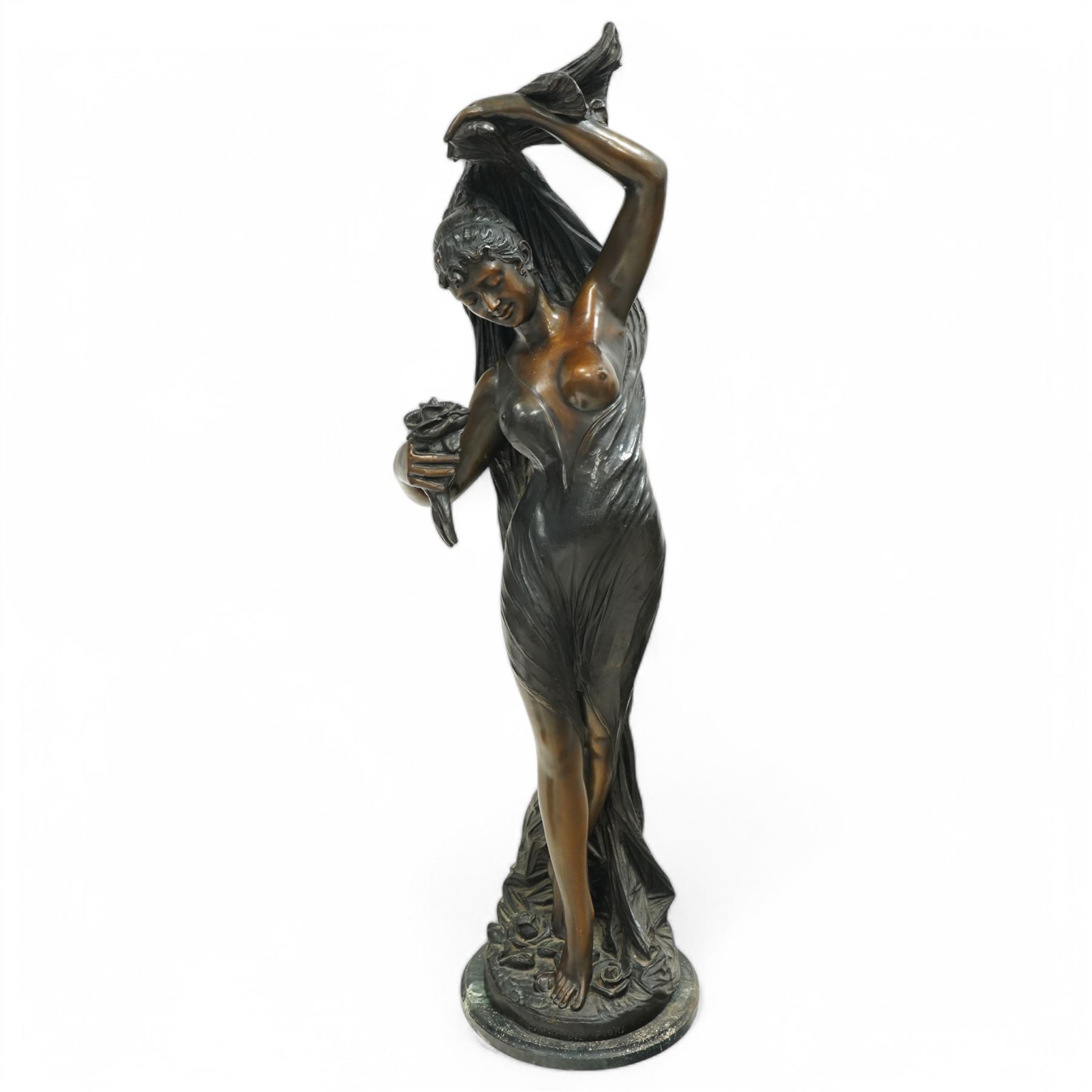 Giorgio Ceragioli (Italian 1861-1947): 'Danza Del Flori' -The Flower Dancer, large patinated bronze figure of a female dancer draped in a flowing garment and holding a rose, on a circular naturalistic floral base, on a marble plinth, signed and dated 1910, titled to the front, H140cm