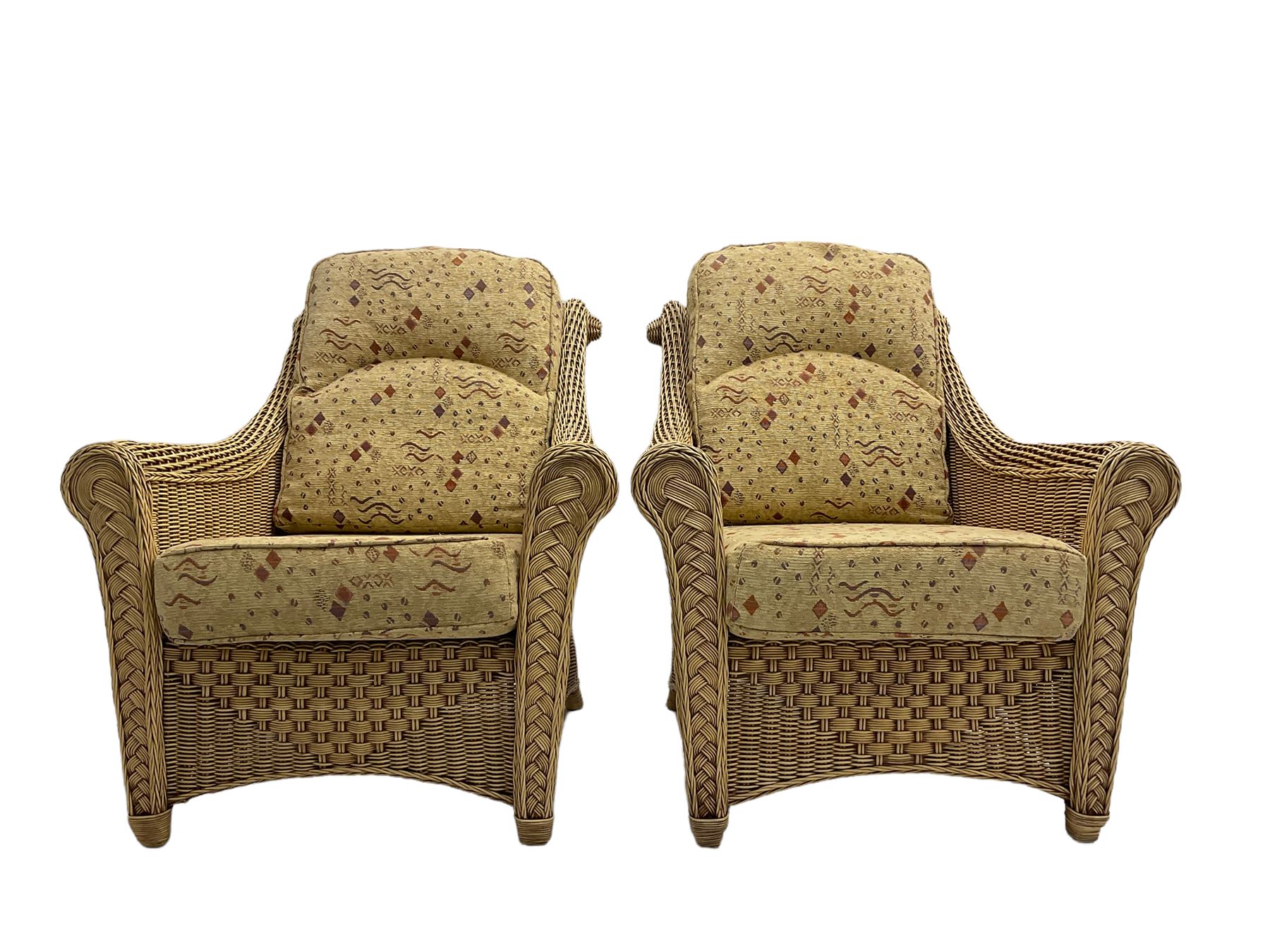 Four piece cane conservatory suite - two seat sofa (W130cm), pair of armchairs (W85cm), and coffee table (85cm x 60cm)