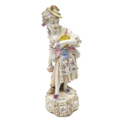  Mid 19th century Meissen figure of a woman clutching a basket, by a tree stump, on scrolled base, underglaze crossed sword mark to base, H33.5cm   
