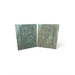 Pair of South East Asian carved wooden panels, depicting Buddha or Deity faces