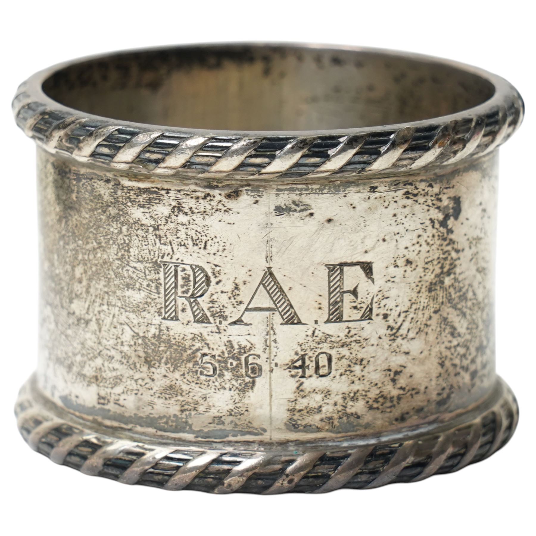 Silver trophy, small silver toast rack and a silver napkin ring