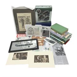 Amy Johnson - collection of memorabilia and ephemera including Amy Johnson Lone Girl Flyer by Charles Dixon and other books; mounted Punch cartoon 'Johnsoniana'; two boxed Oxford Die-Cast model aircraft; photographs; postcards; First Day Covers etc